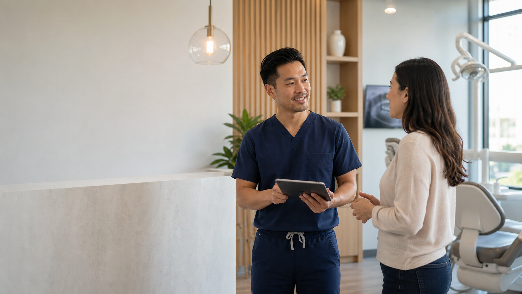 Dentist talking with a patient in a modern premium dental clinic